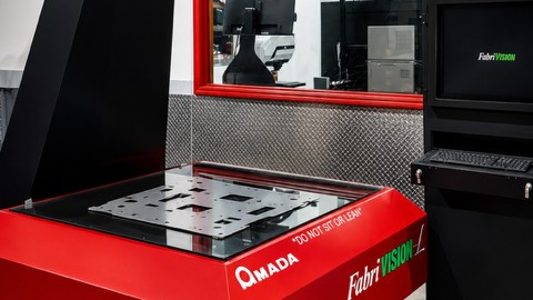 Amada FabriVISION optical inspection system scanning a sheet metal part at MJM Manufacturing in Miami Gardens, Florida